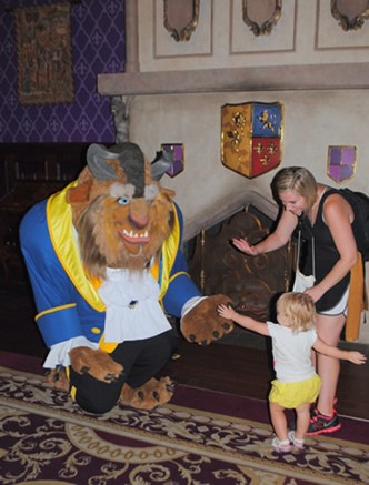 18-month-old Olivia Black is introduced to The Beast (he's referred to as The Master) in his castle which is where tiny tot lunches and dinners are staged. The restaurant is called Be Our Guest.